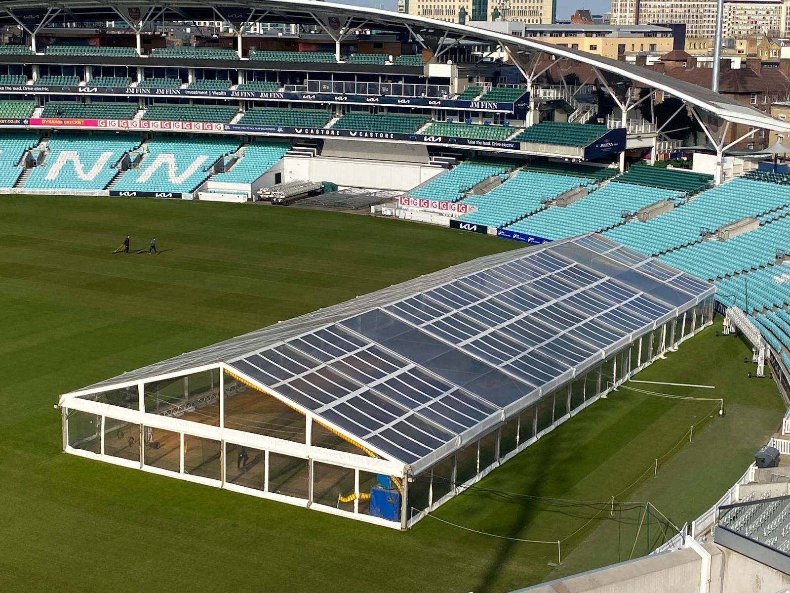 Marquee for winter nets at The Kia Oval in London. The marquee is on the cricket pitch with the stands surrounding. 