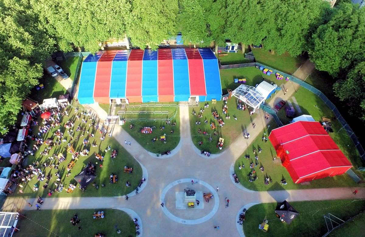 45metre x 25metre clearspan marquee with blue and red festival covers alongside a 15metre x 15metre clearspan marquee with red festival covers in Queens Square Bristol