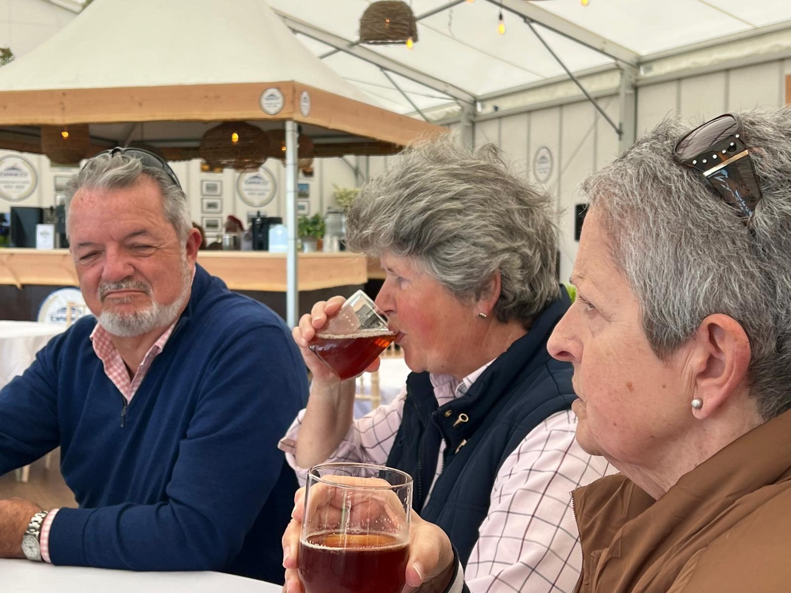 Hospitality guests sipping enjoying refreshments at Danco's 50 year celebration. 