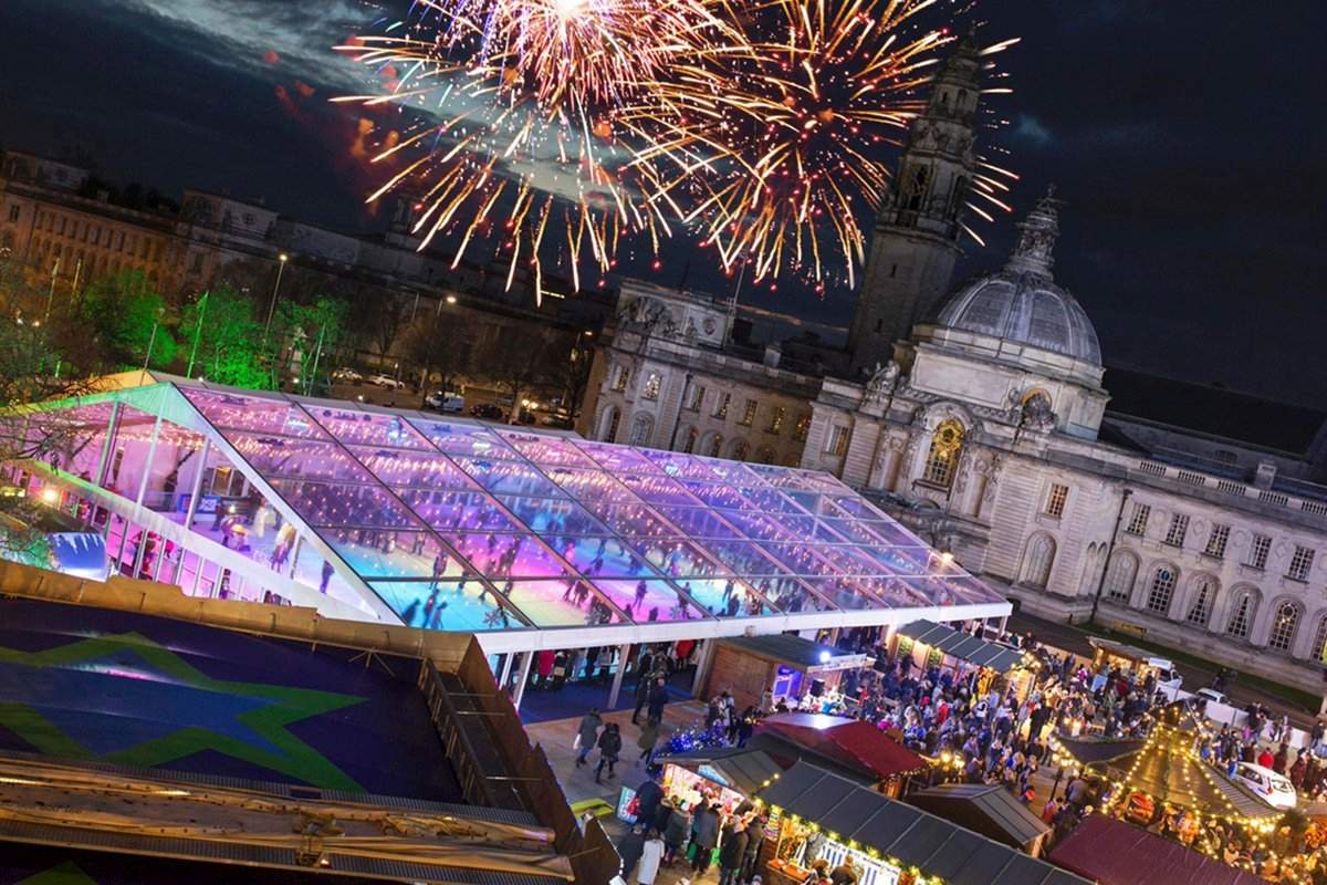 Clearspan marquee with clear covers for an Ice Rink on City Hall Lawns in Cardiff at night with fire works